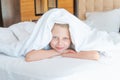 Over blanket sleep girl head pain phone young beautiful view, concept lying female for pillow and happy smile, bedding Royalty Free Stock Photo