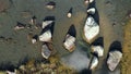 Over rocks in a freezing lake. winter comes, the first ice floes on the water