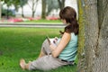 Over should look of young attractive fresh woman at the park writes in notebook journal Royalty Free Stock Photo