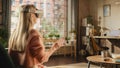 Over the Shoulder Footage of a Female Freelancer Using Virtual Reality Headset and Controllers for