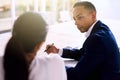 Over the shoulder shot of handsome businessman during executive meeting Royalty Free Stock Photo