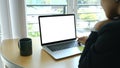 Businesswoman working with laptop computer at office desk. Royalty Free Stock Photo