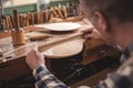 Instrument maker at work at his workbench