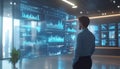 data analyst examining large holographic display of business intelligence charts and data visualizations in modern office Royalty Free Stock Photo