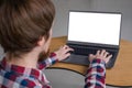 Man hands typing on laptop keyboard with white blank screen - mockup image Royalty Free Stock Photo