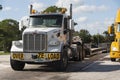 Over size load truck and low trailer on a Florida rest stop Royalty Free Stock Photo