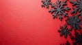 Over a textured deep red background, swirling black snowflakes form a delicate festive pattern Royalty Free Stock Photo