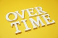 Over Time alphabet letters on yellow background