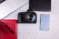 Over top photo of DSLR digital camera and laptop Royalty Free Stock Photo