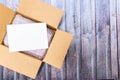 Over the top shot of parcel covered with bubble wrap along wihite in box placed on wooden surface Royalty Free Stock Photo