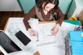 Over top view of architect working at her desk Royalty Free Stock Photo