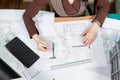 Over top view of architect working at her desk Royalty Free Stock Photo