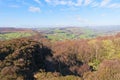 Over the treetops of a small wood to the distant Derbyshire landscape