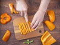 Over view of cutting up orange bell peppers Royalty Free Stock Photo