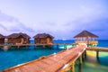 Over water bungalows with steps into amazing green lagoon Royalty Free Stock Photo