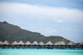 Over water cabins in the Bor Bora island lagoon. Royalty Free Stock Photo