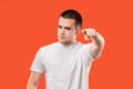 The overbearing businessman point you and want you, half length closeup portrait on orange background.