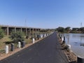 a two combined ways under river nearly high voltages electricity pole in village of India Royalty Free Stock Photo