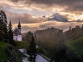 Maria Gern pilgrimage church and mount Watzmann top silhouette through fog, Berchtesgaden, Germany Royalty Free Stock Photo