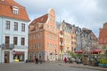 An overcast day in May in the old Riga. People walk on a tourist part of Riga