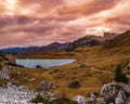 Overcast morning autumn alpine Dolomites mountain scene. Peaceful Valparola Path and Lake view, Belluno, Italy Royalty Free Stock Photo