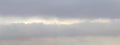 Overcast sky with gray clouds and light stripe in the middle, light blur, sky panorama Royalty Free Stock Photo
