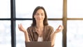 Girl meditating in office coping with stress at workplace Royalty Free Stock Photo