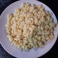 Overcooked pasta horns sprawled on a plate Royalty Free Stock Photo