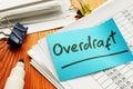 Overdraft sign and stack of accounting documents Royalty Free Stock Photo