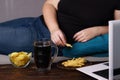 Mindless snacking, overeating, lack of physical activity Royalty Free Stock Photo