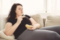 Fat woman overeating junk food. sedentariness