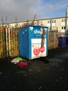 Charity clothing bank overfilled with clothes