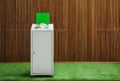 Overfilled trash bin near wooden wall indoors. Recycling concept
