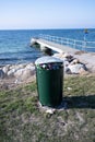 An overfilled trash can by the sea in MalmÃÂ¶, Sweden