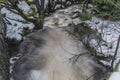 Overflow river Bystrice in Krusne mountains in winter morning