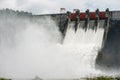 The overflow water in these dams goes through spillways into the river.