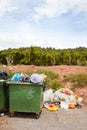 Overflowing bins next to Orange Orchard, Valencia region, Spain