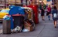 Overflowing garbage bins with household waste