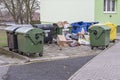 Overflowing garbage bins with household waste in the city