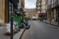 Overflowing garbage bins in the street of Paris, France during pension reform strike in 2023