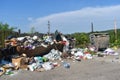 Overflowing garbage can in the city. Rubbish bins overflow with rubbish and thrown on the floor. The bins have not been emptied