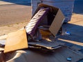 Overflowing garbage container on a street. Recycling concept