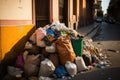 overflowing garbage heap in street after bacchanalia Royalty Free Stock Photo