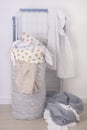 Overflowing Laundry Basket Dirty Laundry on the Floor Drying Frame Household Chore Concept Vertical