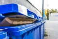 Overflowing Paper Recycling Storage Bin Dumpster Row Multiple Outdoors Corner Closeup Detail Blue Outdoors Daytime Public