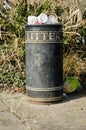 Overflowing rubbish bin at park