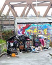 Overflowing rubbish bins. Garbage management & urban graffiti