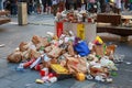 Overflowing rubbish bins surrounded by fast food waste