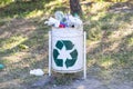 Overflowing trash bins in the park. Dumpster being full with garbage