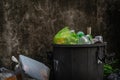 Overflowing trash can with plastic waste Royalty Free Stock Photo